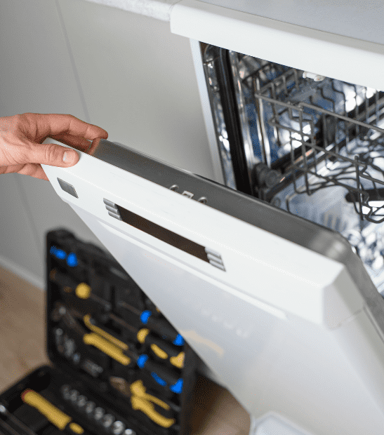 Technician repairing a dishwasher in Durango, CO