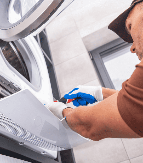 Technician repairing a dryer in Durango, CO