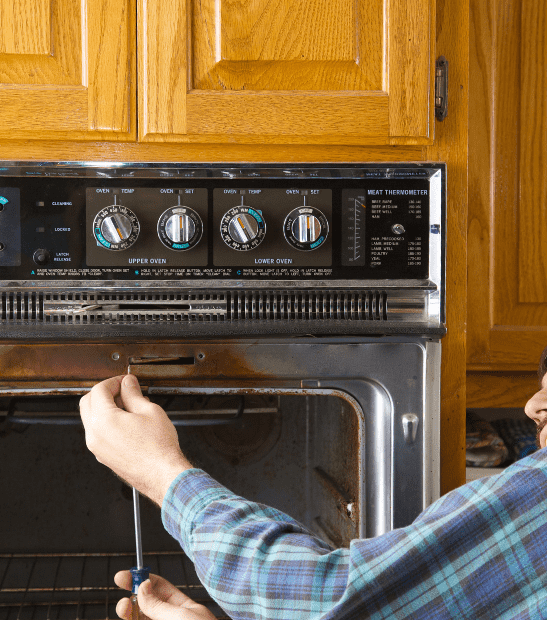 Technician repairing an oven in Durango, CO