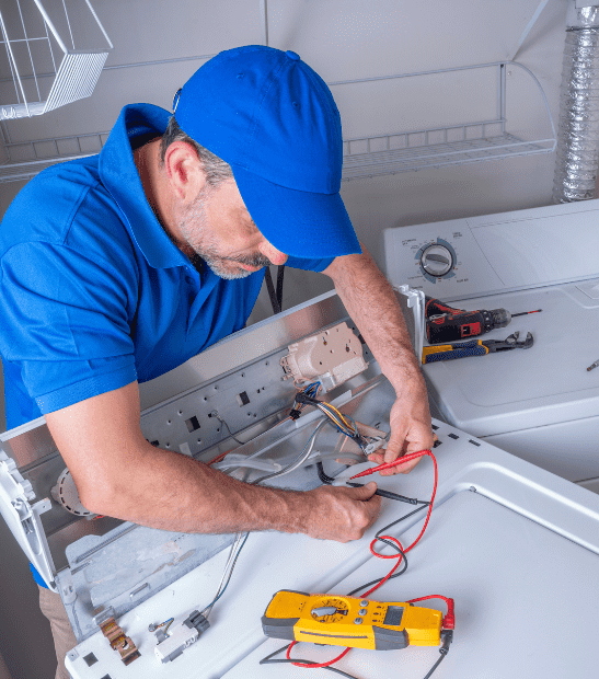 Technician repairing a washing machine in Durango, CO