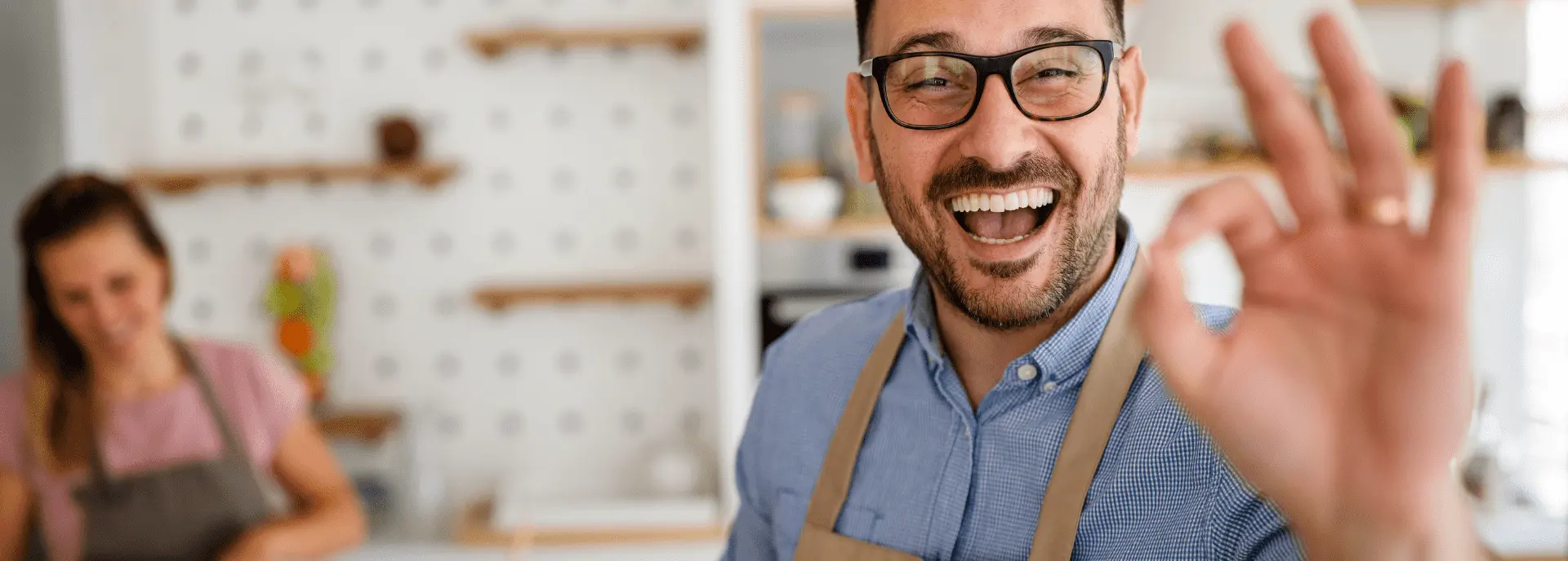 A happy Advanced Appliance Repair customer in their kitchen